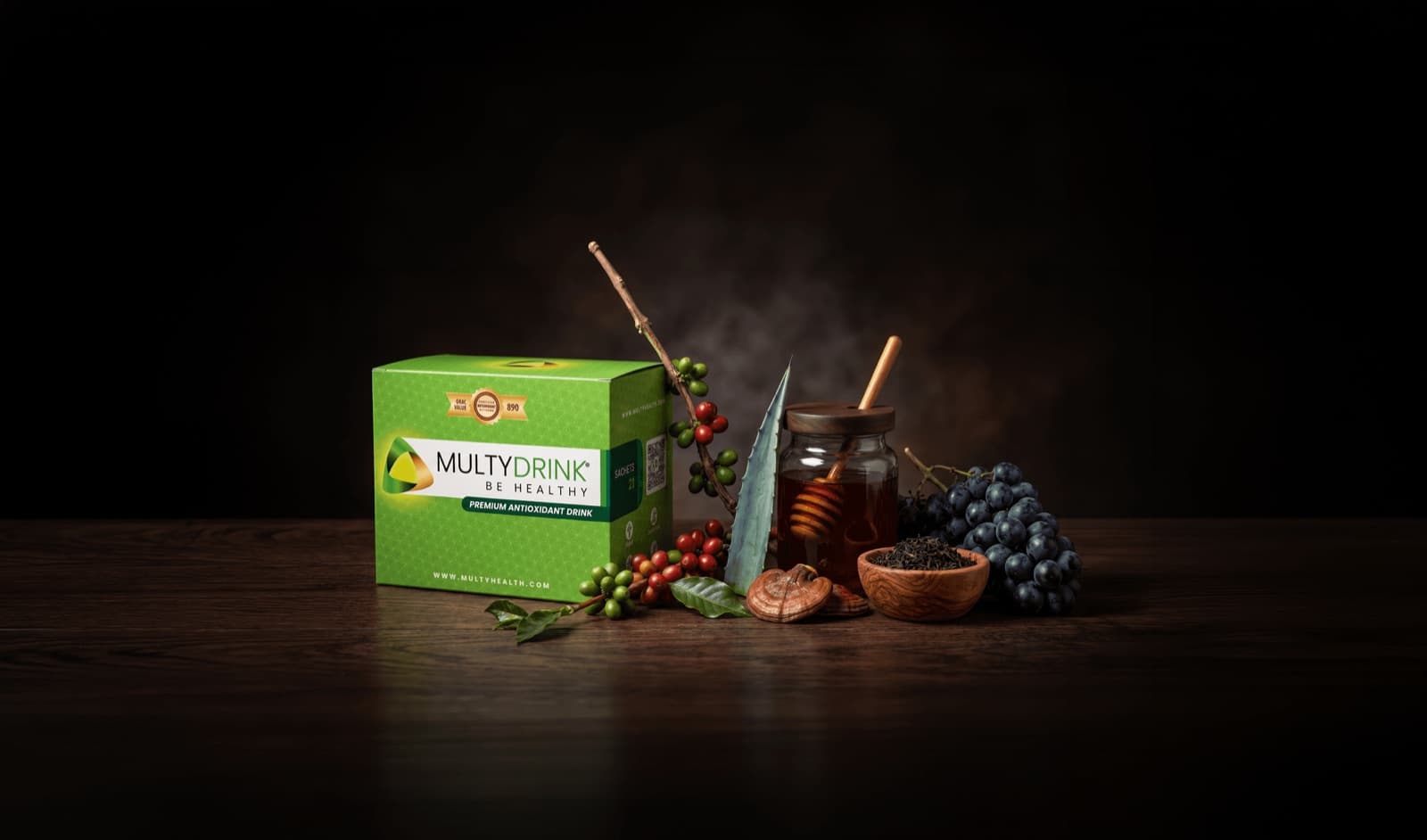 Caja de MultyDrink junto a sus ingredientes naturales: miel, café, ganoderma, té negro y uva, sobre un fondo oscuro